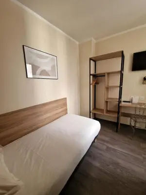 Un ou plusieurs lits dans un hébergement de l'établissement Hôtel D'Anjou