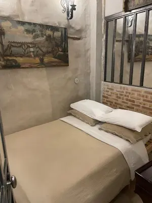 Un ou plusieurs lits dans un hébergement de l'établissement Marais Romantique Paris centre 4 chambres