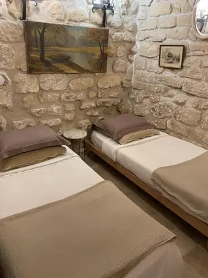 Un ou plusieurs lits dans un hébergement de l'établissement Marais Romantique Paris centre 4 chambres