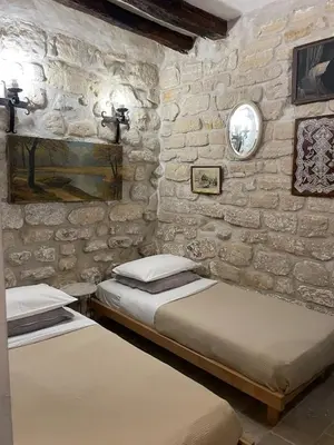 Un ou plusieurs lits dans un hébergement de l'établissement Marais Romantique Paris centre 4 chambres