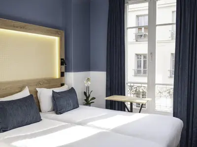 Un ou plusieurs lits dans un hébergement de l'établissement ibis Styles Paris Montmartre Nord