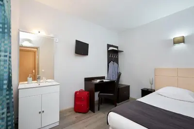 Un ou plusieurs lits dans un hébergement de l'établissement Hôtel Viator