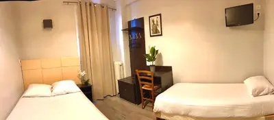 Un ou plusieurs lits dans un hébergement de l'établissement Hôtel Viator
