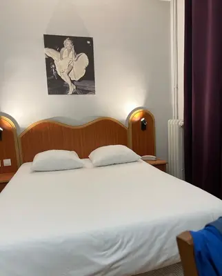 Un ou plusieurs lits dans un hébergement de l'établissement Hôtel Viator