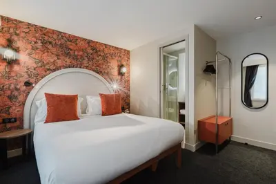 Un ou plusieurs lits dans un hébergement de l'établissement Hotel Prince Albert Opéra