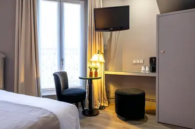 Un ou plusieurs lits dans un hébergement de l'établissement Gardette Park Hotel