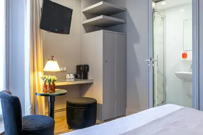 Un ou plusieurs lits dans un hébergement de l'établissement Gardette Park Hotel