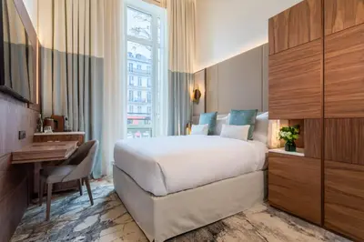 Un ou plusieurs lits dans un hébergement de l'établissement InterContinental Paris Champs Elysées Etoile by IHG