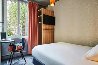 Un ou plusieurs lits dans un hébergement de l'établissement ibis Styles Paris Alesia Montparnasse