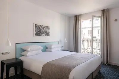 Un ou plusieurs lits dans un hébergement de l'établissement Hotel Palm - Astotel