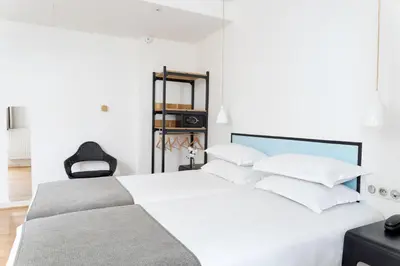 Un ou plusieurs lits dans un hébergement de l'établissement Hotel Palm - Astotel