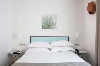 Un ou plusieurs lits dans un hébergement de l'établissement Hotel Palm - Astotel