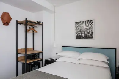 Un ou plusieurs lits dans un hébergement de l'établissement Hotel Palm - Astotel