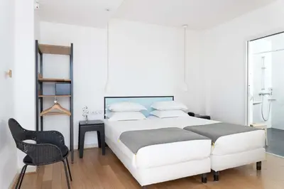Un ou plusieurs lits dans un hébergement de l'établissement Hotel Palm - Astotel