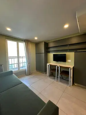 Télévision ou salle de divertissement dans l'établissement MULTIRESIDENCE L'ELYSEE Paris