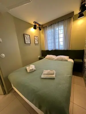 Un ou plusieurs lits dans un hébergement de l'établissement MULTIRESIDENCE L'ELYSEE Paris