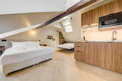 Un ou plusieurs lits dans un hébergement de l'établissement Hôtel Marie