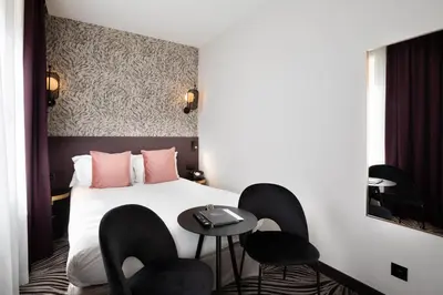 Un ou plusieurs lits dans un hébergement de l'établissement Hôtel Prince Albert Gare de Lyon