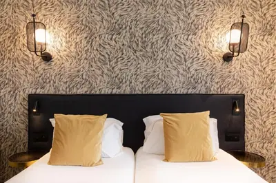 Un ou plusieurs lits dans un hébergement de l'établissement Hôtel Prince Albert Gare de Lyon