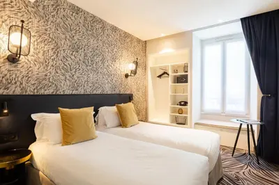 Un ou plusieurs lits dans un hébergement de l'établissement Hôtel Prince Albert Gare de Lyon