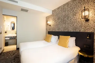 Un ou plusieurs lits dans un hébergement de l'établissement Hôtel Prince Albert Gare de Lyon