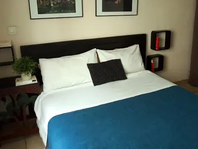 Un ou plusieurs lits dans un hébergement de l'établissement Appartement lumineux avec balcon au coeur de Paris