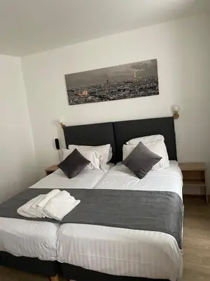 Un ou plusieurs lits dans un hébergement de l'établissement Hôtel de Bordeaux