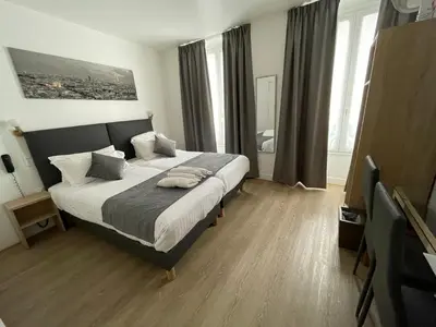 Un ou plusieurs lits dans un hébergement de l'établissement Hôtel de Bordeaux