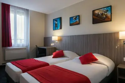 Un ou plusieurs lits dans un hébergement de l'établissement Reims Hotel