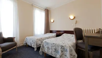 Un ou plusieurs lits dans un hébergement de l'établissement Grand Hôtel De L'Europe
