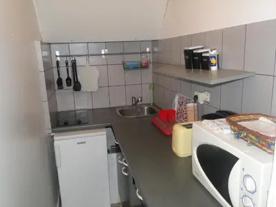 Cuisine ou kitchenette dans l'établissement Appartement NOTRE DAME