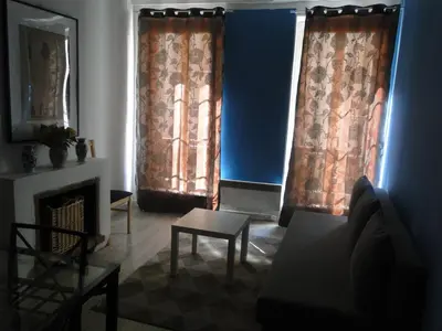 Coin salon dans l'établissement Appartement NOTRE DAME