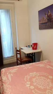 Un ou plusieurs lits dans un hébergement de l'établissement Hotel Feria (FR)