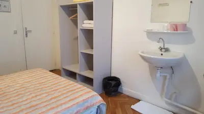 Un ou plusieurs lits dans un hébergement de l'établissement Hotel Feria (FR)