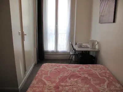 Un ou plusieurs lits dans un hébergement de l'établissement Hotel Feria (FR)
