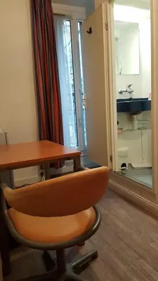 Télévision ou salle de divertissement dans l'établissement Hotel Feria (FR)