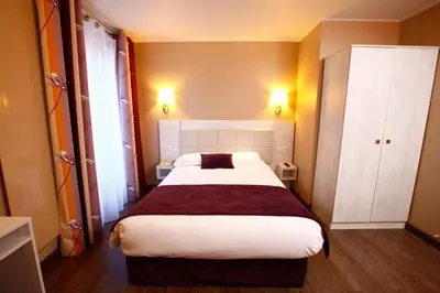 Un ou plusieurs lits dans un hébergement de l'établissement Hôtel Sunny