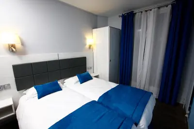 Un ou plusieurs lits dans un hébergement de l'établissement Hôtel Sunny