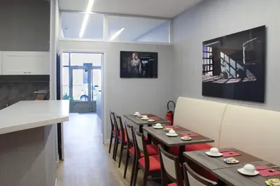 Coin salon dans l'établissement Hôtel De France