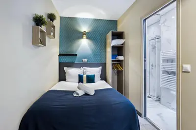 Un ou plusieurs lits dans un hébergement de l'établissement Résidence AURMAT - Appart - Hôtel - Boulogne - Paris