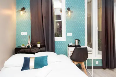 Un ou plusieurs lits dans un hébergement de l'établissement Résidence AURMAT - Appart - Hôtel - Boulogne - Paris