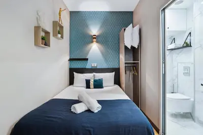 Un ou plusieurs lits dans un hébergement de l'établissement Résidence AURMAT - Appart - Hôtel - Boulogne - Paris