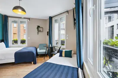 Un ou plusieurs lits dans un hébergement de l'établissement Résidence AURMAT - Appart - Hôtel - Boulogne - Paris