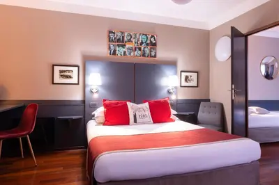 Un ou plusieurs lits dans un hébergement de l'établissement Hotel George Sand Opéra Paris
