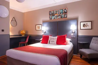 Un ou plusieurs lits dans un hébergement de l'établissement Hotel George Sand Opéra Paris