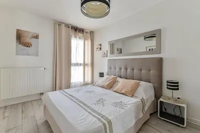 Un ou plusieurs lits dans un hébergement de l'établissement Appartement Glamour