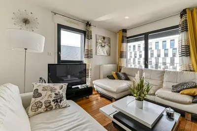Coin salon dans l'établissement Appartement Glamour