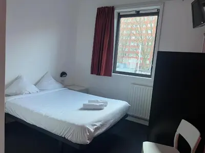 Un ou plusieurs lits dans un hébergement de l'établissement Résidence Internationale De Paris