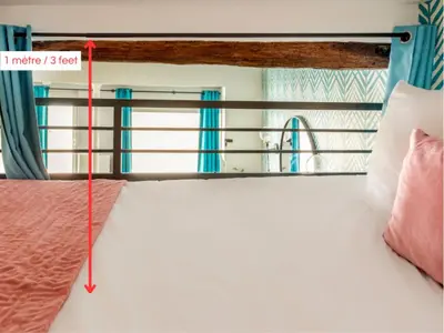 Un ou plusieurs lits dans un hébergement de l'établissement Merveil - Luxury Suite - Champs Elysées - Mermoz