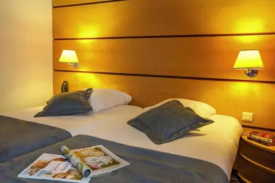 Un ou plusieurs lits dans un hébergement de l'établissement Belambra Clubs & Hotels - Le Magendie